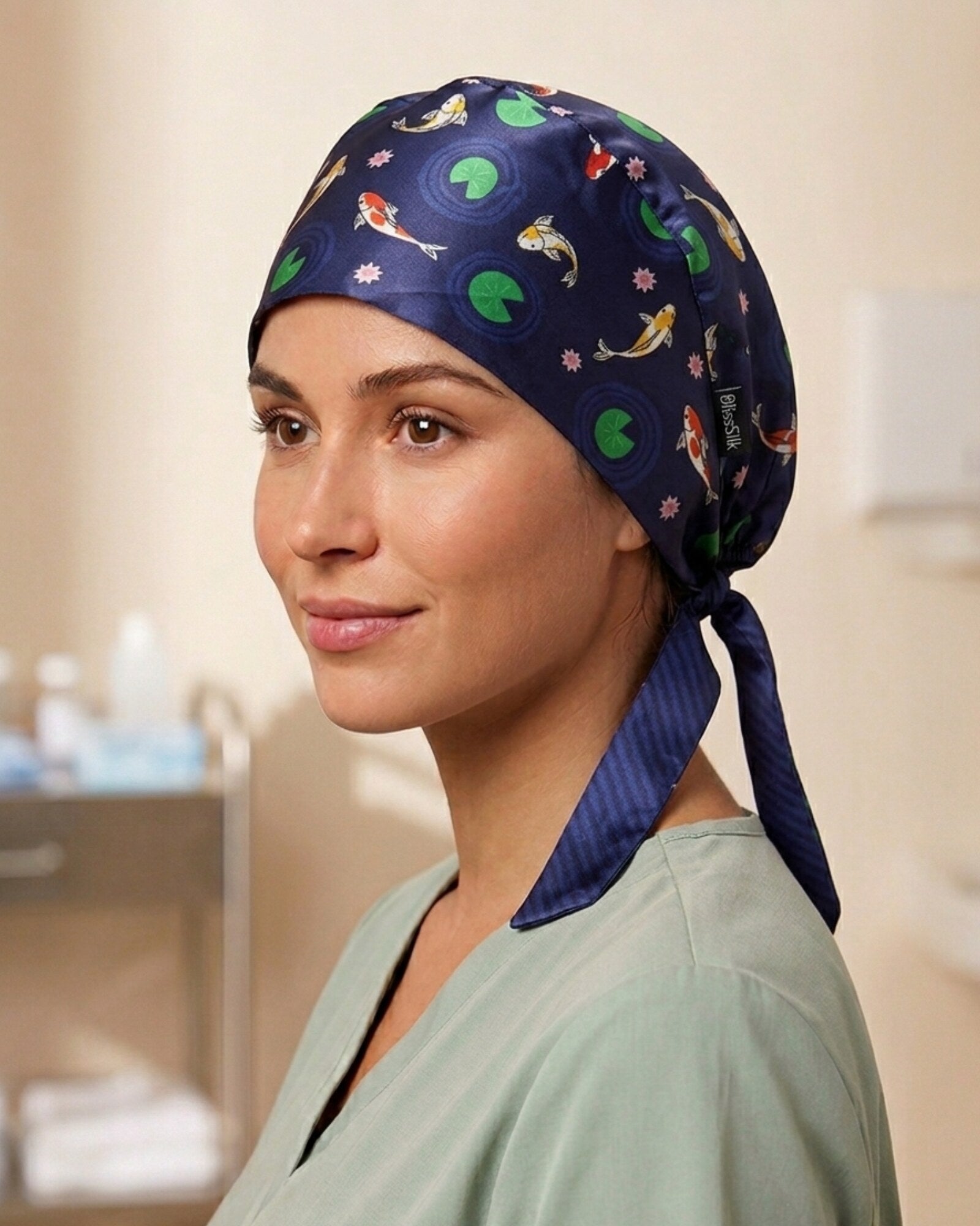 Model wearing BlissSilk mulberry silk scrub cap in koi fish print