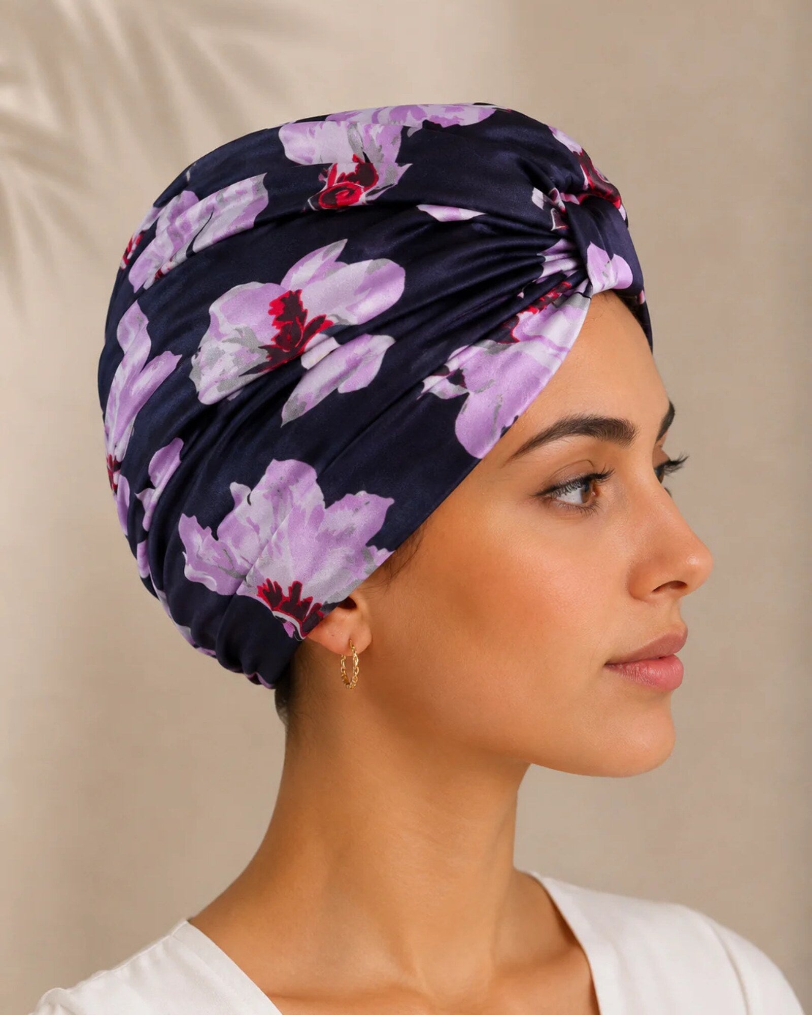 Model wearing BlissSilk mulberry silk turban in blue floral print, front view