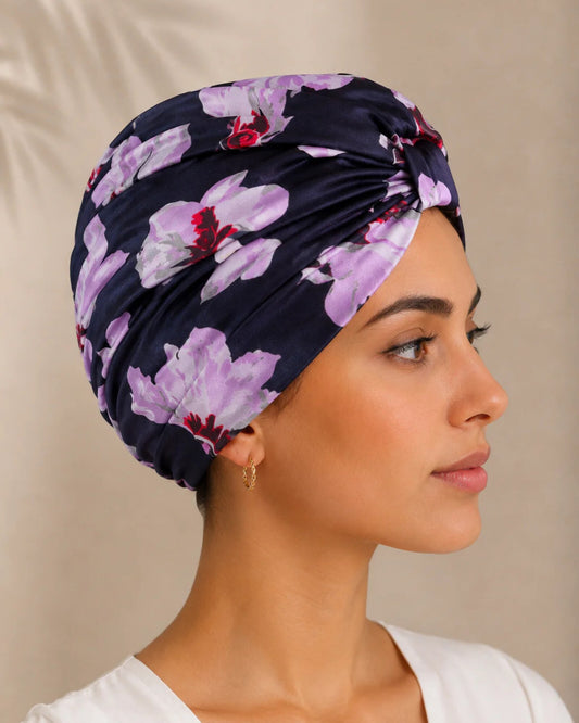 Model wearing BlissSilk mulberry silk turban in blue floral print, front view